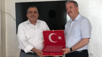 ŞEHİT MÜZE MÜDÜRÜNÜN AİLESİNE ANLAMLI ZİYARET